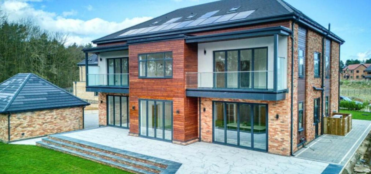 Contemporary home with expansive glazing, balcony and garden-facing doors from the DBM gallery